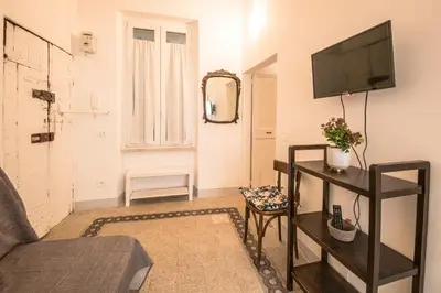 a living room with a tv and a couch at Casa degli Spagoli Navona Square in Rome