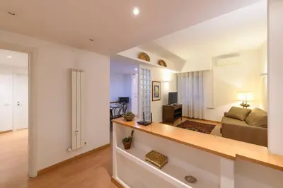 a living room with a couch and a table at St Peter s Home, nel cuore della Città Eterna in Rome