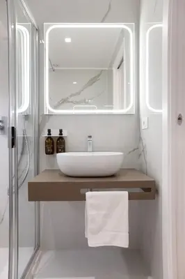 a bathroom with a sink and a mirror at 56 Orange Street Luxury Accommodation in Rome