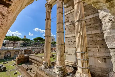 an archway in the ruins of the library ofgarrettratesratesktopktop at Exentia Stays - Luxury Apartment Colosseum in Rome
