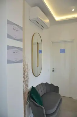 a room with a couch and a mirror on the wall at Vatican View Experience in Rome