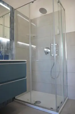 a shower with a glass door in a bathroom at Vatican View Experience in Rome