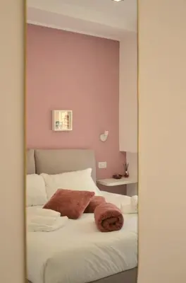 a mirror reflection of a bed in a bedroom at Vatican View Experience in Rome