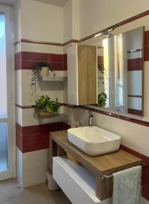 a bathroom with a sink and a mirror at Casa Bibbi in Rome