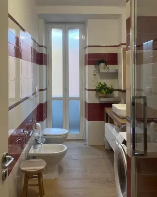 a bathroom with a toilet and a sink at Casa Bibbi in Rome