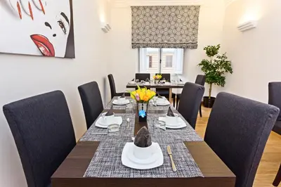 a dining room with a table and chairs at Domus Best Guest House in Rome