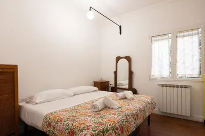 a bedroom with a bed with two towels on it at Elegant apartment in Trastevere in Rome