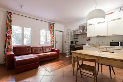 a living room with a couch and a table at Elegant apartment in Trastevere in Rome