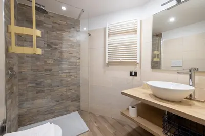 a bathroom with a sink and a mirror at Cesare Balbo - B&D Apts in Rome