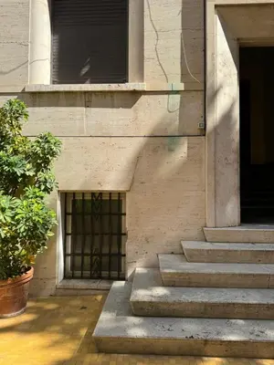 a building with stairs and a window and a door at Elegante appartamento con terrazzo in Rome