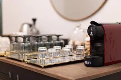 a tray of glasses sitting on top of a counter at Residenza Lucrezio in Rome