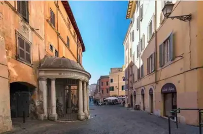 an empty street in an old town with buildings at Loft in the Ghetto in Rome