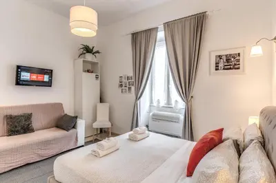 a living room with a bed and a couch at Loft in the Ghetto in Rome