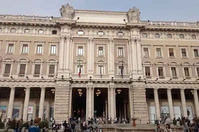 a large building with people walking in front of it at Loft Torlonia in Rome center town in Rome