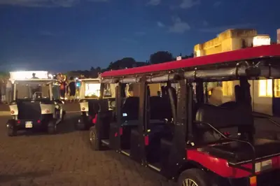 a group of golf carts parked in a parking lot at Loft Torlonia in Rome center town in Rome