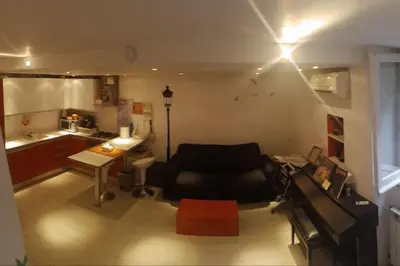 a living room with a couch and a table at Little Villa Well connected in Rome