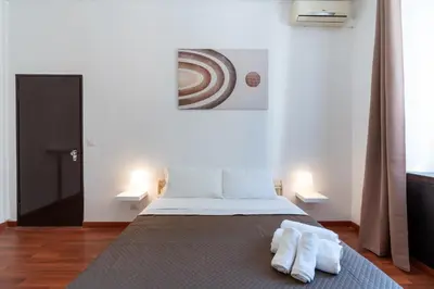 a bedroom with a bed with two towels on it at Typical & Cozy Apartment - Testaccio - Trastevere in Rome