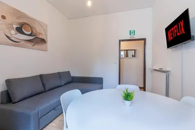 a living room with a couch and a table at Typical & Cozy Apartment - Testaccio - Trastevere in Rome