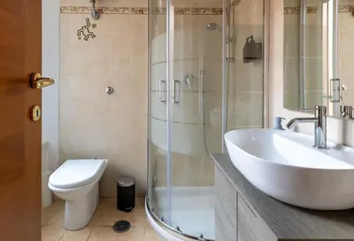 a bathroom with a shower and a sink and a toilet at Maurice's Apt, hidden gem in Rome for food lovers in Rome