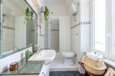 a bathroom with a sink and a toilet at Maurice's Apt, hidden gem in Rome for food lovers in Rome