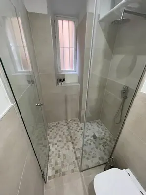 a shower with a glass door in a bathroom at Rome Vatican Home in Rome
