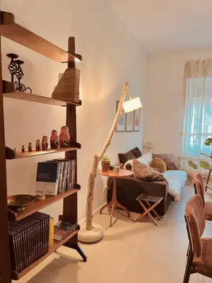 a bedroom with a bed and a table with a lamp at La Casa di Monteverde in Rome