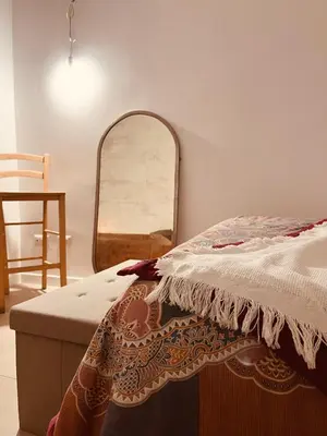 a kitchen table with two chairs and a bowl on it at La Casa di Monteverde in Rome