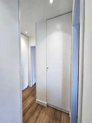a room with a large white closet with a mirror at Angelico 70 - Amazing flat near the Vatican Museum in Rome