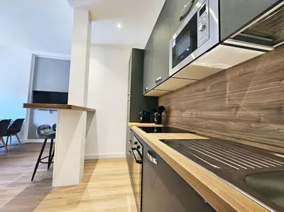 a kitchen with a sink and a microwave at Angelico 70 - Amazing flat near the Vatican Museum in Rome