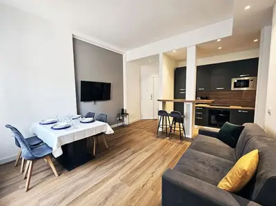 a living room with a couch and a table at Angelico 70 - Amazing flat near the Vatican Museum in Rome
