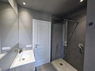 a bathroom with a sink and a shower at Angelico 70 - Amazing flat near the Vatican Museum in Rome