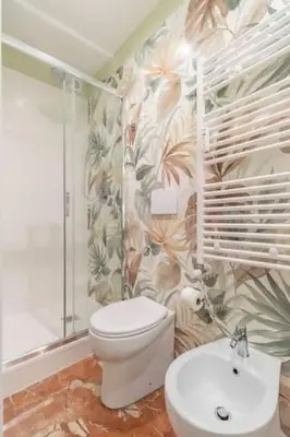 a bathroom with a toilet and a sink at Residenza Cocchina Apt in Rome