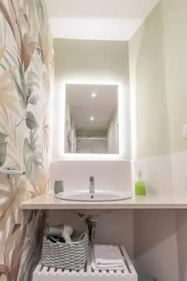 a bathroom with a sink and a mirror at Residenza Cocchina Apt in Rome