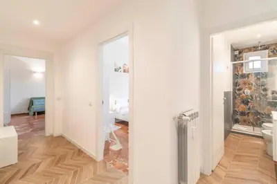 a white room with a bathroom with a toilet at Residenza Cocchina Apt in Rome