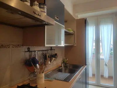a kitchen with a stainless steel sink and a window at Anna Lucia's Flat vicino a Trastevere e al San Camillo in Rome