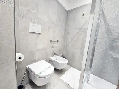 a bathroom with a shower and a toilet and a sink at Via Aubry 1- Vatican Museum in Rome