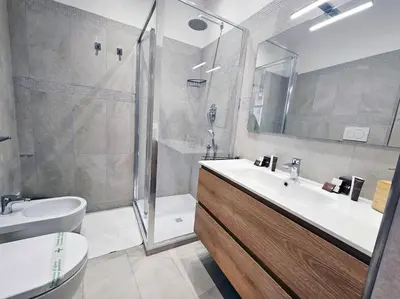 a bathroom with a sink and a shower and a toilet at Via Aubry 1- Vatican Museum in Rome