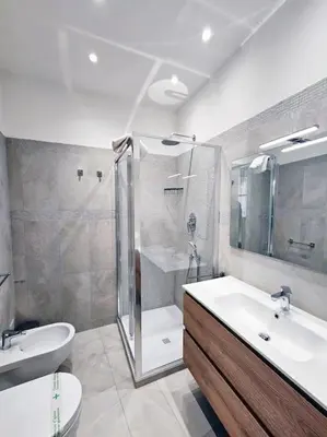 a bathroom with a shower and a sink and a toilet at Via Aubry 1- Vatican Museum in Rome