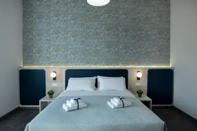 a bedroom with a large bed with two pillows at DoppioSei in Rome