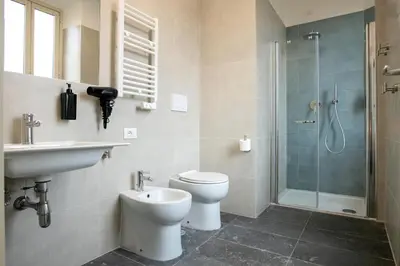 a bathroom with a toilet and a sink and a shower at DoppioSei in Rome
