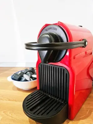 a red toaster sitting on top of a wooden table at Gabri 19 - Elegant Escape in Piazzale Flaminio in Rome
