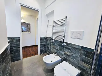 a bathroom with a toilet and a sink at Gabri 19 - Elegant Escape in Piazzale Flaminio in Rome