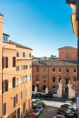a view of a city with cars parked in a parking lot at H77 Apartments - Maison D'Art Collection in Rome