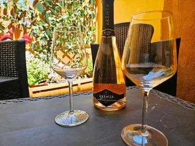 a bottle of wine and two glasses on a table at Vicolo di Monte del Gallo 24 - Vatican City in Rome
