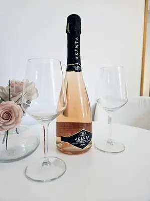 a bottle of champagne and two wine glasses on a table at Vicolo di Monte del Gallo 24 - Vatican City in Rome