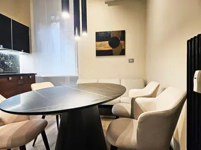 a dining room with a table and chairs at Lungotevere Testaccio 11 - Amazing Flat in Rome in Rome