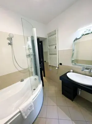 a bathroom with a white toilet and a sink at Casa Beatriz - Amazing Apartment in Rome in Rome