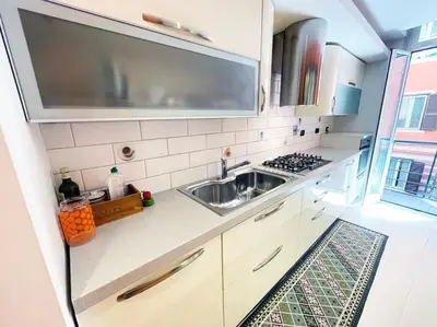 a kitchen with a sink and a stove at Casa Beatriz - Amazing Apartment in Rome in Rome