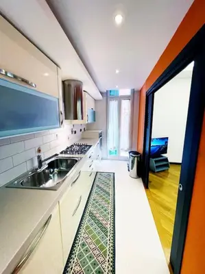 a kitchen with a sink and a stove at Casa Beatriz - Amazing Apartment in Rome in Rome