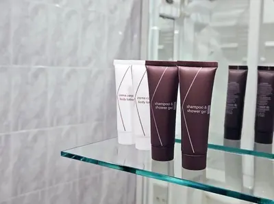 a group of four products on a glass shelf at Carlo Rusconi 10 - Trastevere in Rome